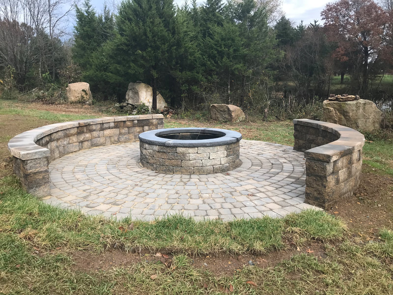 Paver firepit with captstone.  Paver patio with seating walls. 