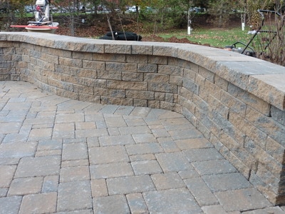 Paver patio and seating wall with capstone. 