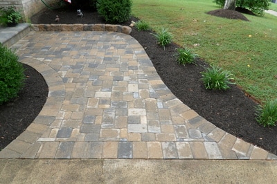 Walkway from driveway to stoop.  Paver stoop with edger stones. 