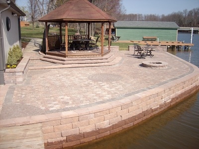 Paver patio and seawall with bullnose steps and raised beds. 