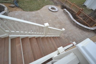 Paver patio with seating wall and permanent firepit with capstone. 