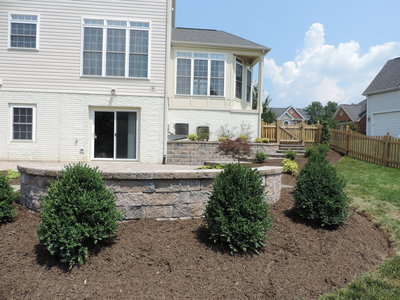 Paver seating and retaining walls with landscaping. 