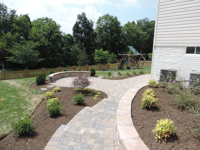 Paver steps.  Paver retaining wall.  Paver Seating wall.  Paver raised beds.  Landscaping. 
