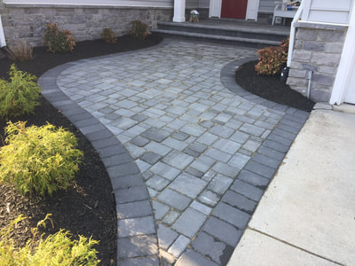 Paver walkway from driveway to stoop.  Paver stoop with bullnose steps. 