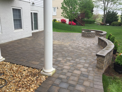 Paver patio with paver seating walls and firepit. 