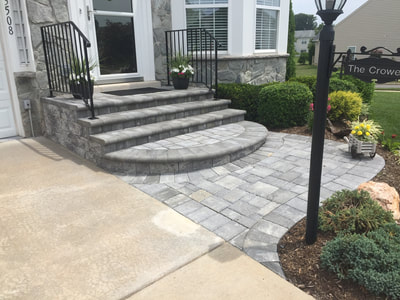 Paver walkway. Paver stoop with bullnose steps. Landscaping. 