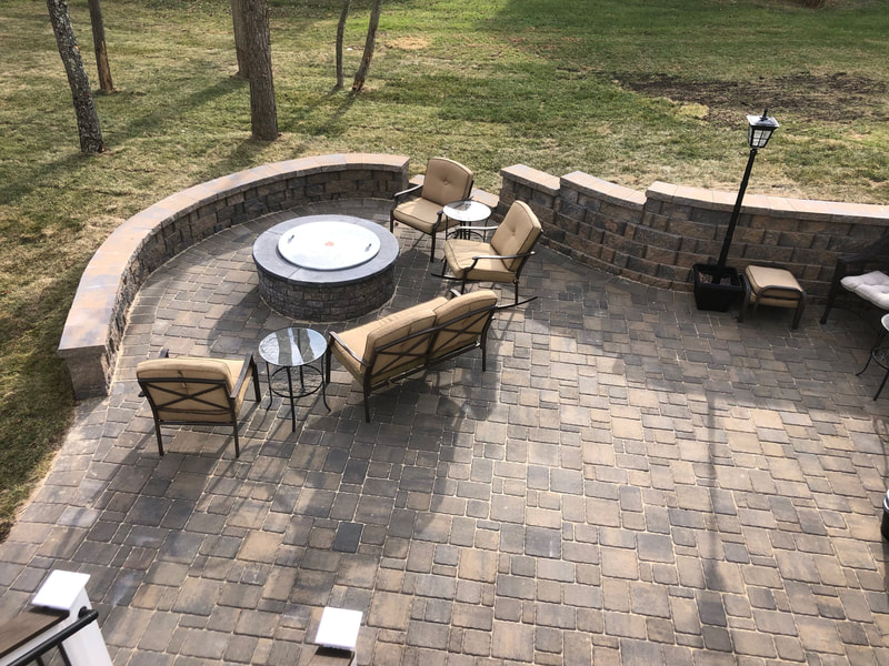 Paver patio with seating wall and retaining wall. 