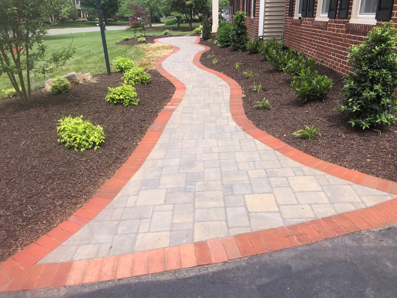 Paver walkway with brick soldier course. 