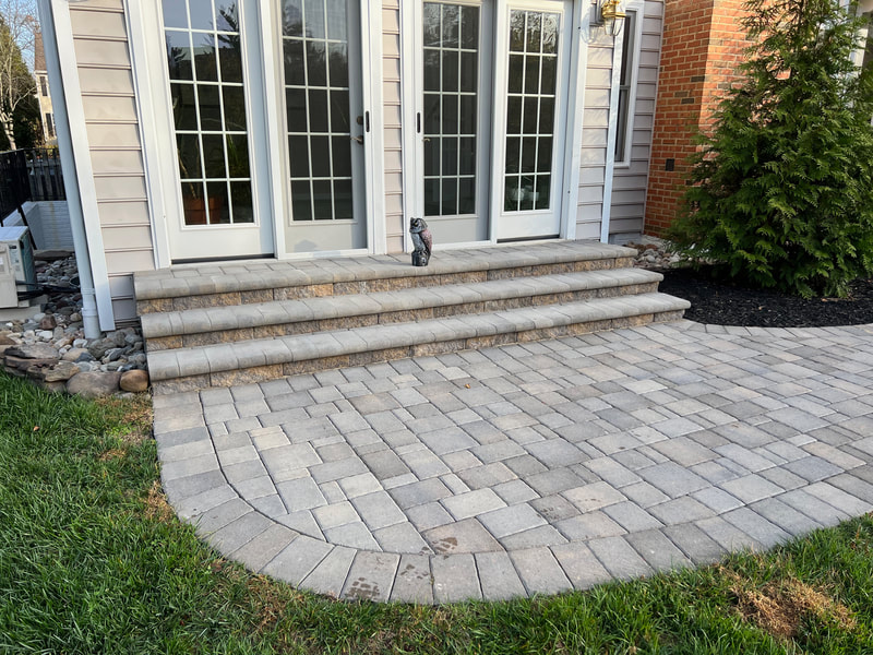 Paver walkway from patio doors to patio and deck.  Paver stoop with bullnose paver steps. 