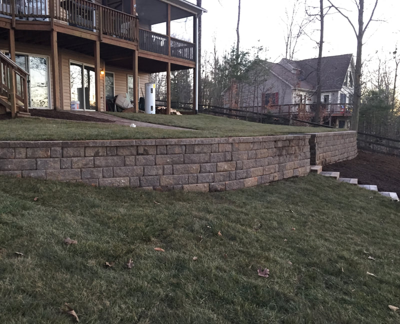 3' retaining wall.  Paver and stone steps. walkway and patio under deck. 