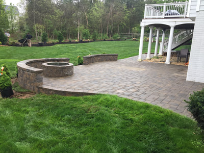 Paver patio.  Paver wallstone seating walls with capstone.  Paver permanent fire pit with metal insert. 