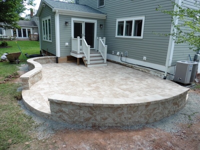 Paver patio with seating wall and capstone. 