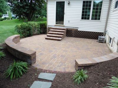 Paver patio and deck steps with bullnose.  Seating walls with capstone. 